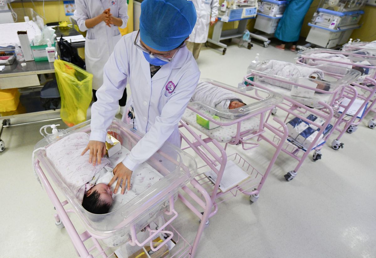 A newborn baby is seen being cared for in the ward of the hospital neonatal care center. The results of the seventh national census of China will be released soon, and some institutions predict that the birth rate will be lower than the death rate for the first time.