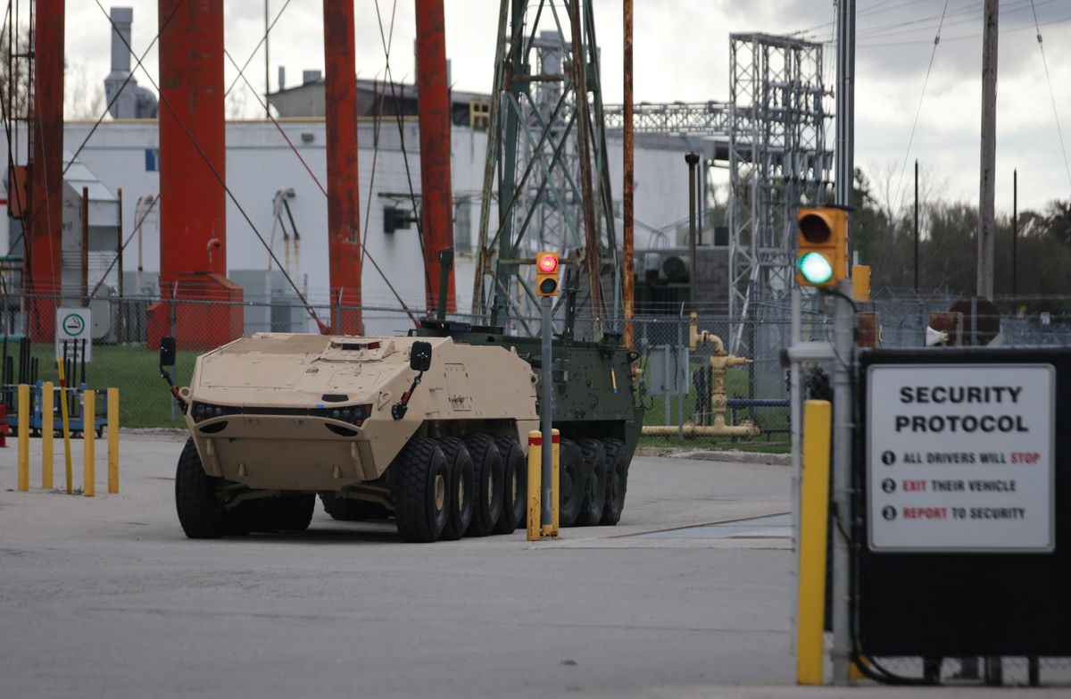 A pair of armored personnel carriers parked at the General Dynamics Land Systems Canada factory in London, Ontario.