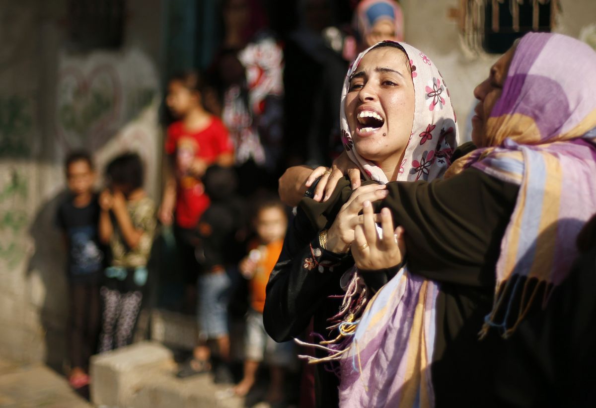 A Palestinian woman reacts after the death of her sister 