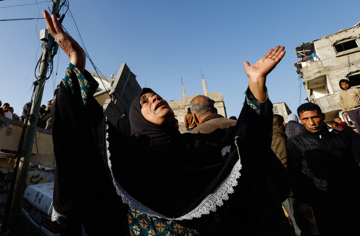 ​A Palestinian woman reacts to an Israeli airstrike amid the ongoing conflict between Israel and the Palestinian Islamist group Hamas, in Rafah, in the southern Gaza Strip, on March 3, 2024. 
