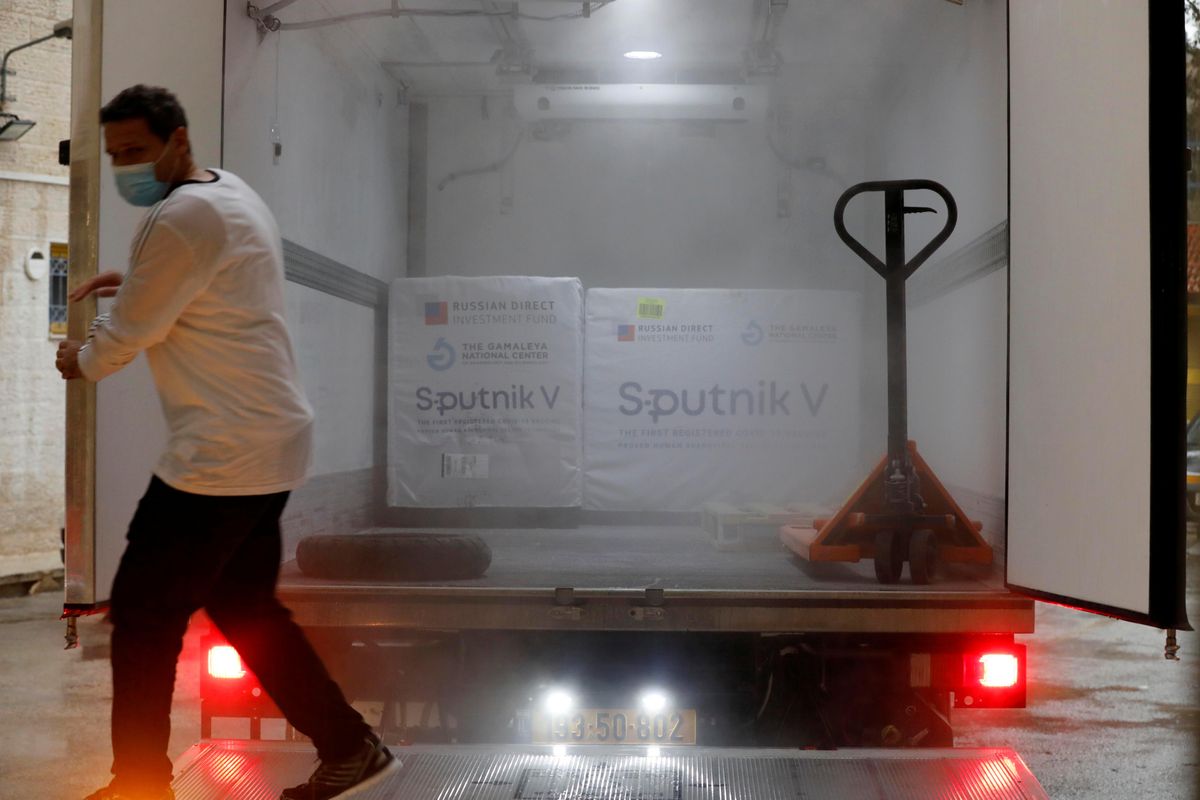 A Palestinian worker prepares to unload a shipment of Russia's Sputnik V vaccine amid the coronavirus disease (COVID-19) outbreak, in Ramallah in the Israeli-occupied West Bank February 4, 2021.