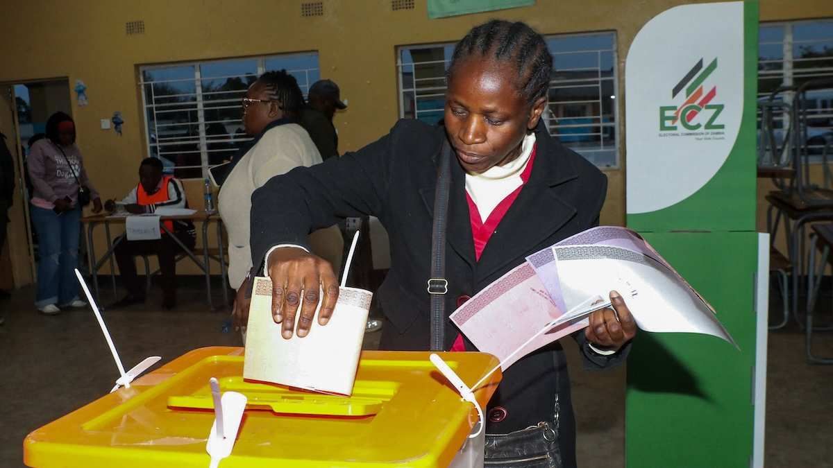 A person casts a vote at a polling station during Zambia's general elections, including a presidential election, in Lusaka, Zambia.