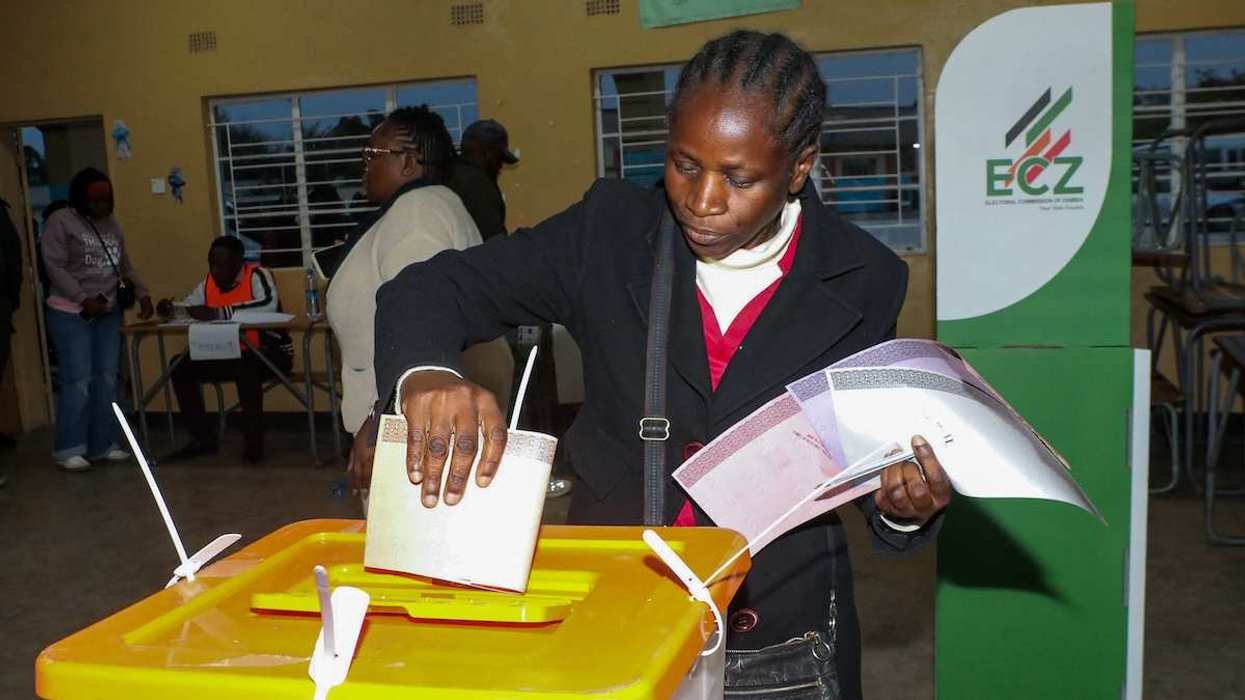 A person casts a vote at a polling station during Zambia's general elections, including a presidential election, in Lusaka, Zambia.