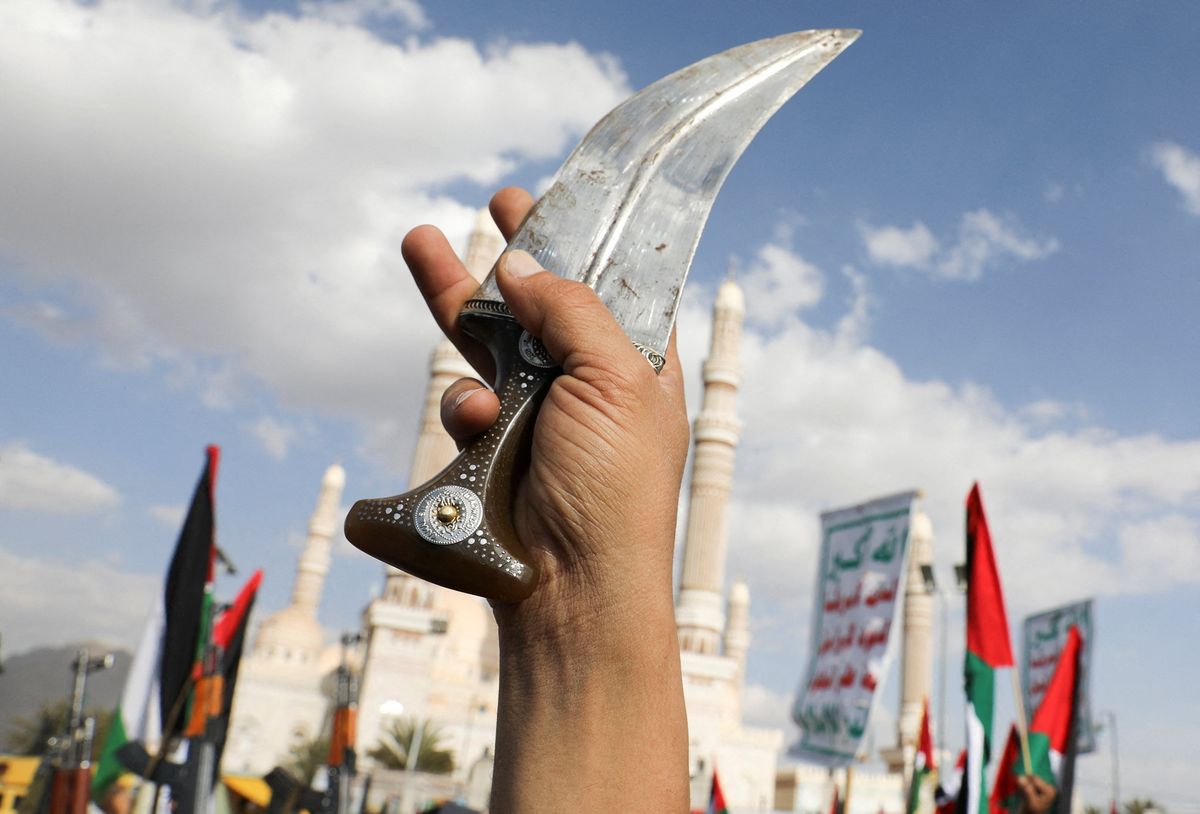 A person holds up a dagger, known as jambiya, as Houthi supporters rally to commemorate ten Houthi fighters killed by the U.S. Navy in the Red Sea, in Sanaa, Yemen January 5, 2024.