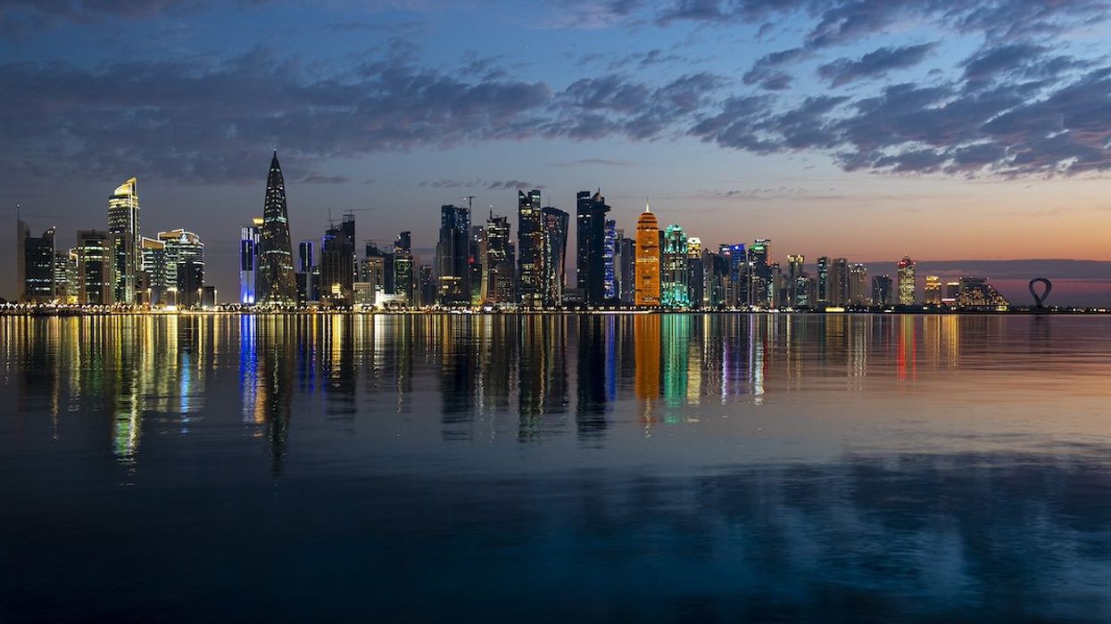 A picture taken on 20 April 2023 shows a general view of the West Bay skyline in Doha corniche at sunrise in Doha,Qatar on 20 April 2023