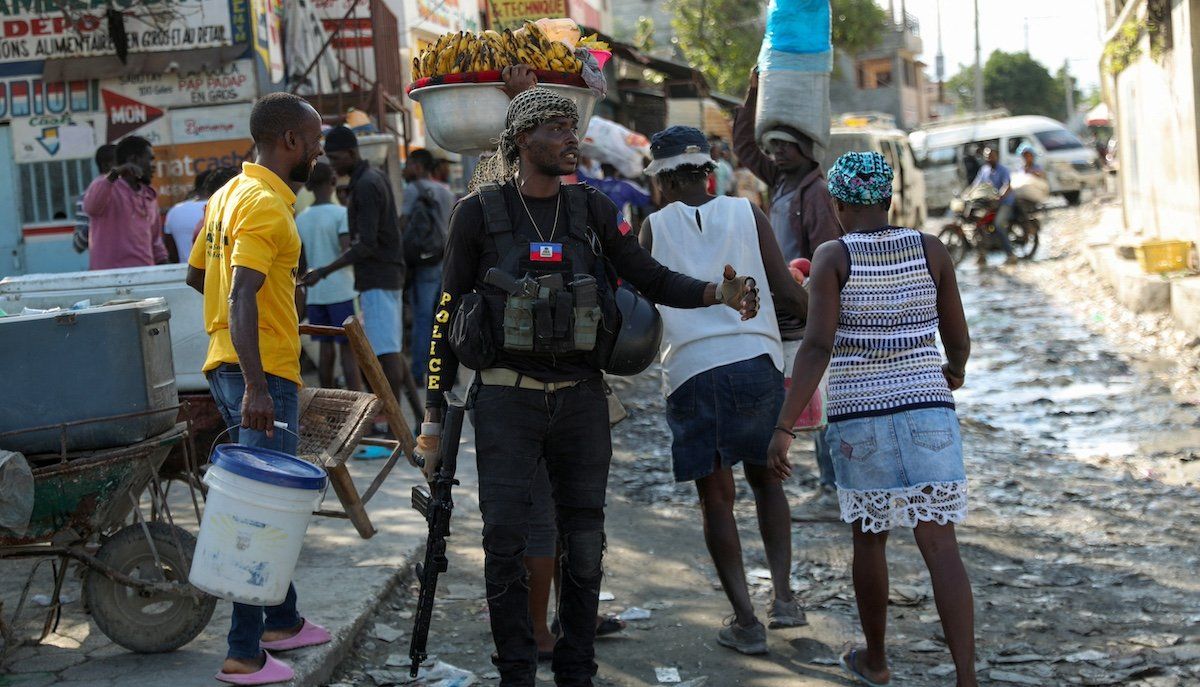 ​A police officer patrols near the police headquarters as Haiti continues in a state of emergency, in Port-au-Prince, Haiti March 6, 2024. 