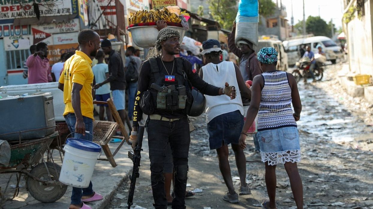 A police officer patrols near the police headquarters as Haiti continues in a state of emergency, in Port-au-Prince, Haiti March 6, 2024.