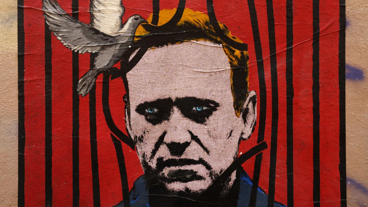 A poster by street artist Harry Greb depicting Russian opposition leader Alexey Navalny in Rome. Reuters