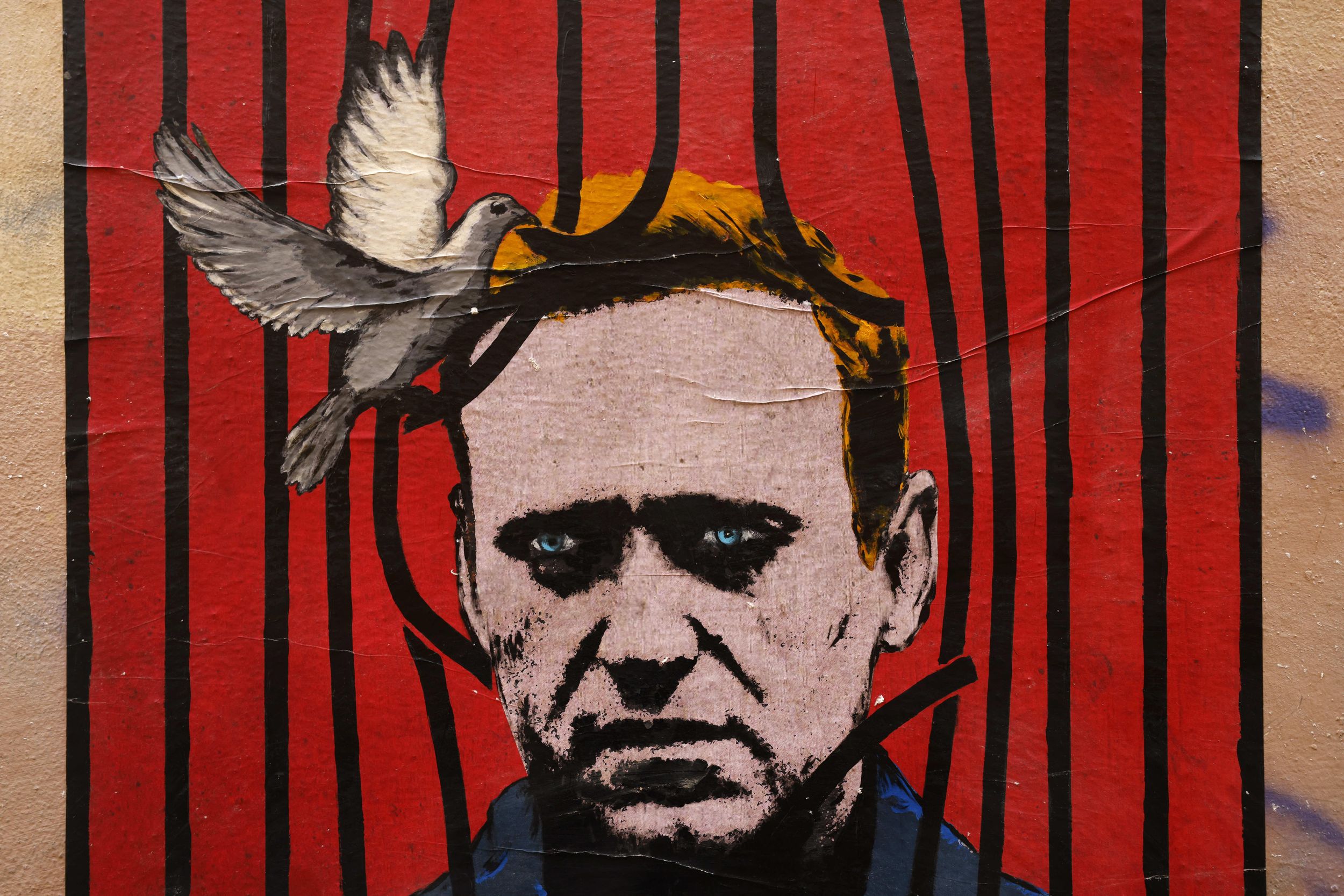 A poster by street artist Harry Greb depicting Russian opposition leader Alexey Navalny in Rome. Reuters