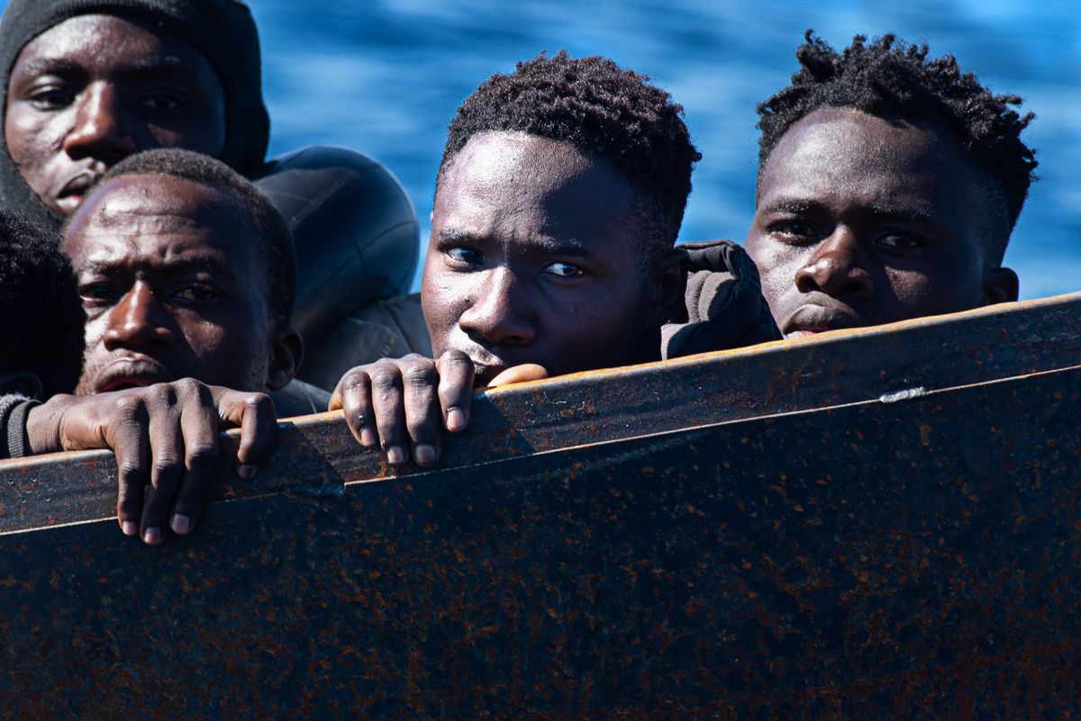 A precarious metal boat carrying 40-50 migrants across the Mediterranean from Africa. 