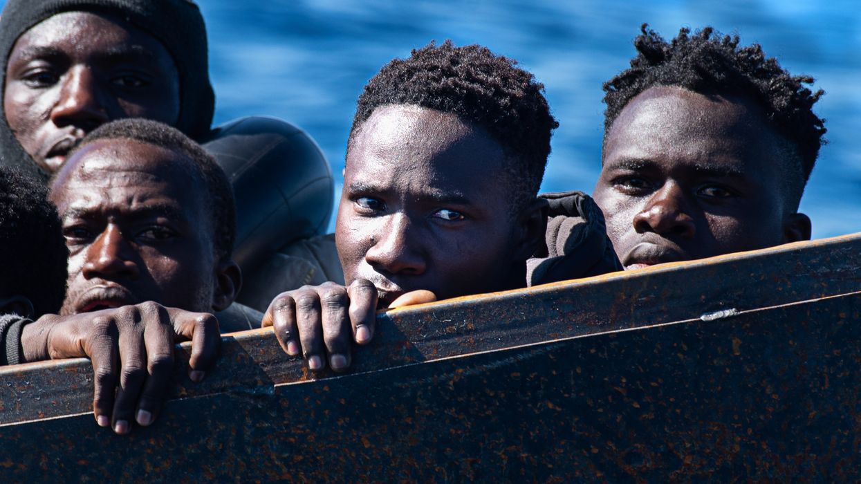 A precarious metal boat carrying 40-50 migrants across the Mediterranean from Africa.