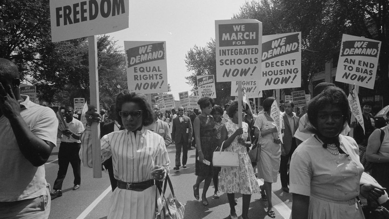 A procession carrying signs for equal rights, integrated schools, decent housing, and an end to bias during the civil rights march in Washington, DC, on Aug. 28, 1963.