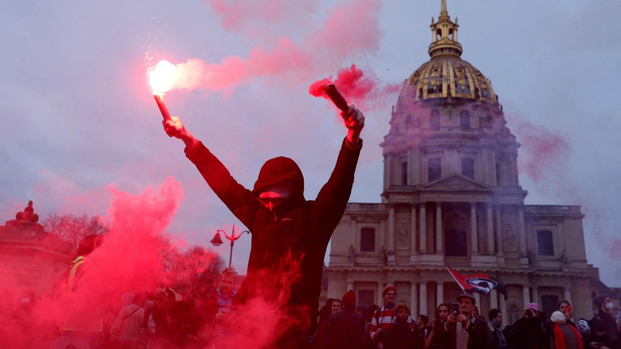 A protester near the Invalides during a demonstration against the government's pension reform plan in Paris