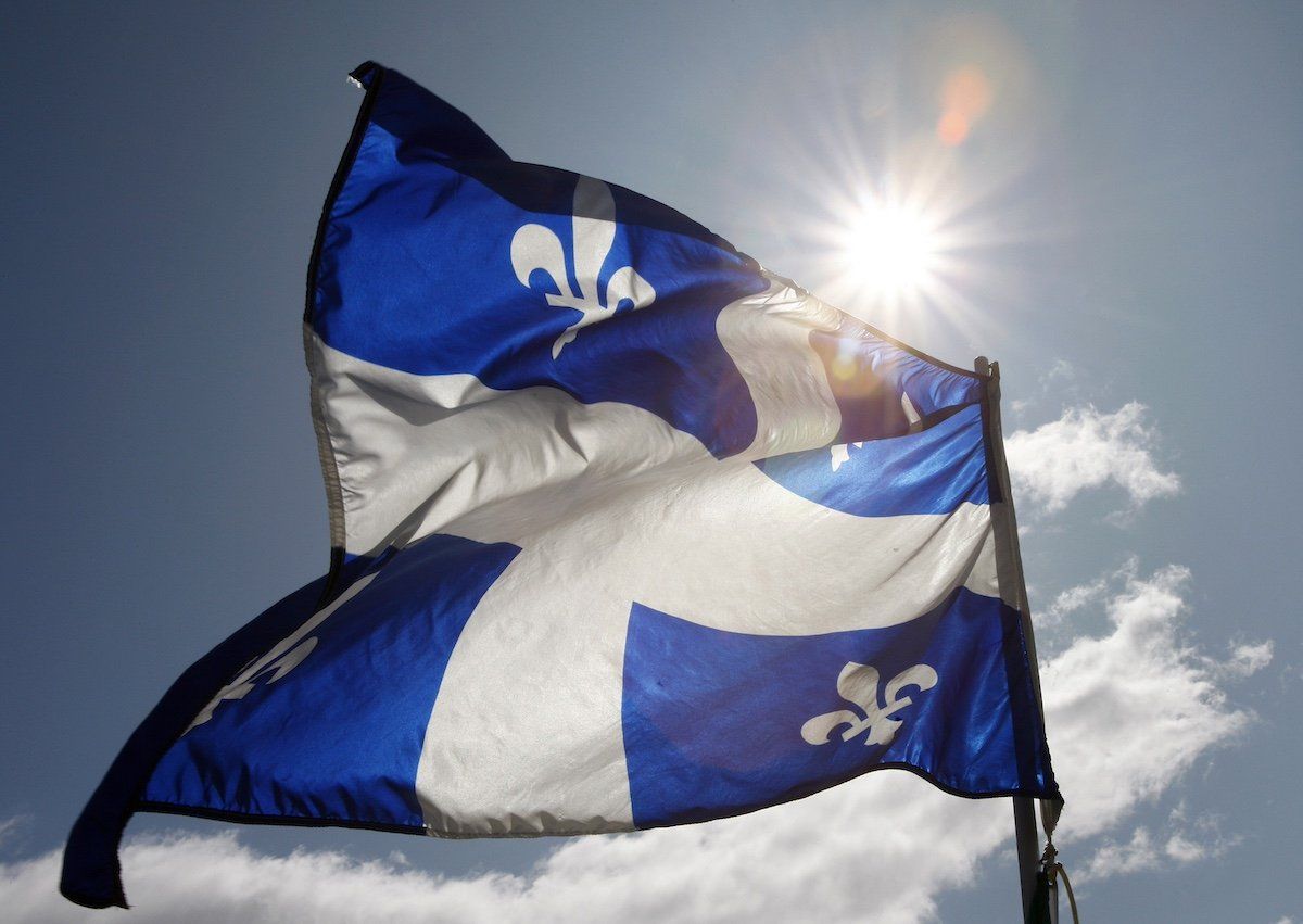 A Quebec flag flaps in the sky during the Moulin a Parole, a 24-hour long series of public readings, on the Plains of Abraham in Quebec City, September 13, 2009.