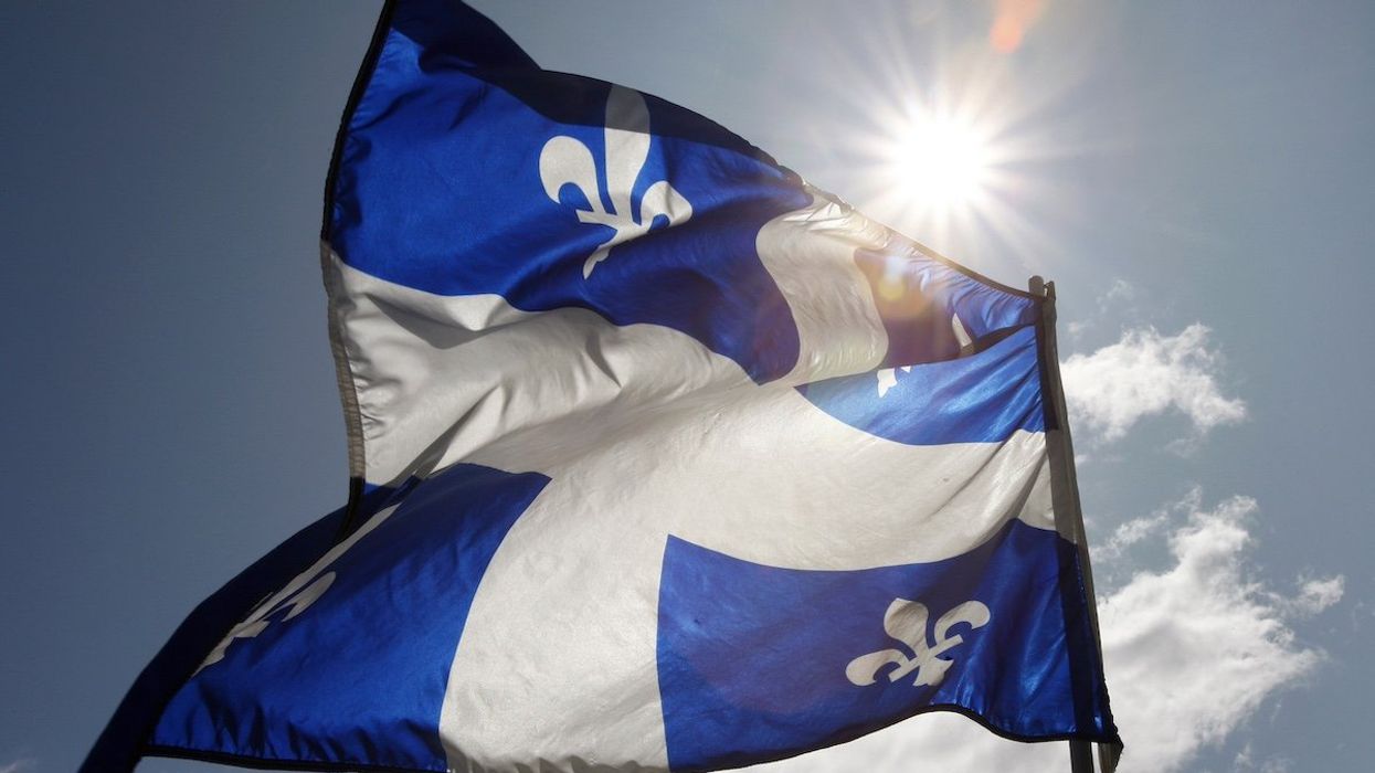 A Quebec flag flaps in the sky during the Moulin a Parole, a 24-hour long series of public readings, on the Plains of Abraham in Quebec City, September 13, 2009.