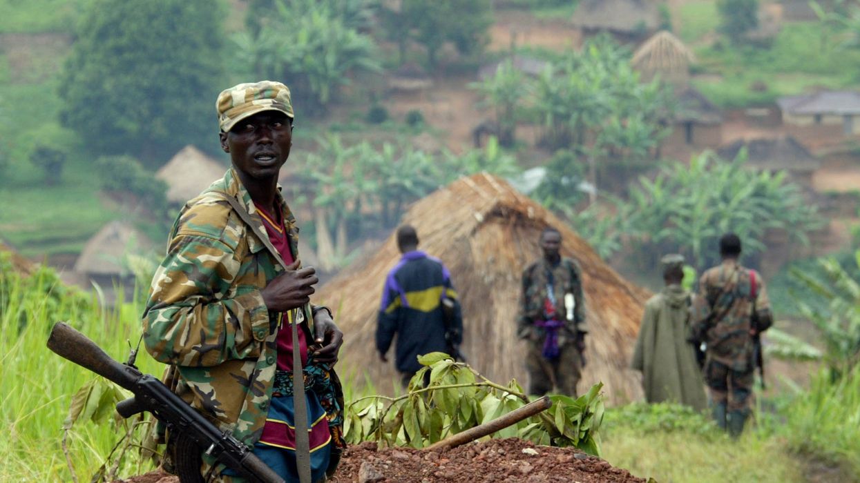 A renegade Congolese soldier stands at an outpost in Eastern Congo deserted town of Kanyabayonga December 16, 2004 which is deserted due to clashes in the area. The Democratic Republic of Congo has replaced its army commander in the eastern province of North Kivu, the scene of days of fighting between government reinforcements and rebel units, authorities said.