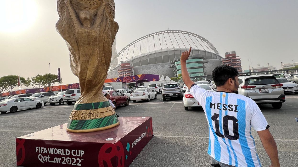 A sculpture of the World Cup trophy is pictured in front of Khalifa International Stadium in Doha.