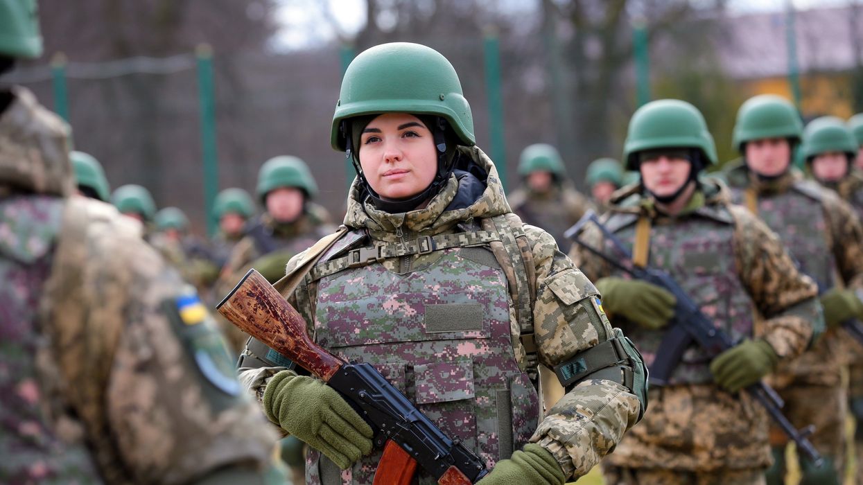 A servicewoman holds a rifle during the graduation ceremony of the officers of the Armed Forces of Ukraine of the Hetman Petro Sahaidachnyi National Academy of Land Forces, in the Lviv Region of western Ukraine.