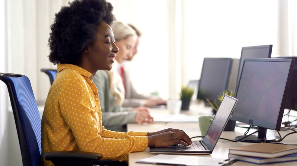 A small group of people working at laptops