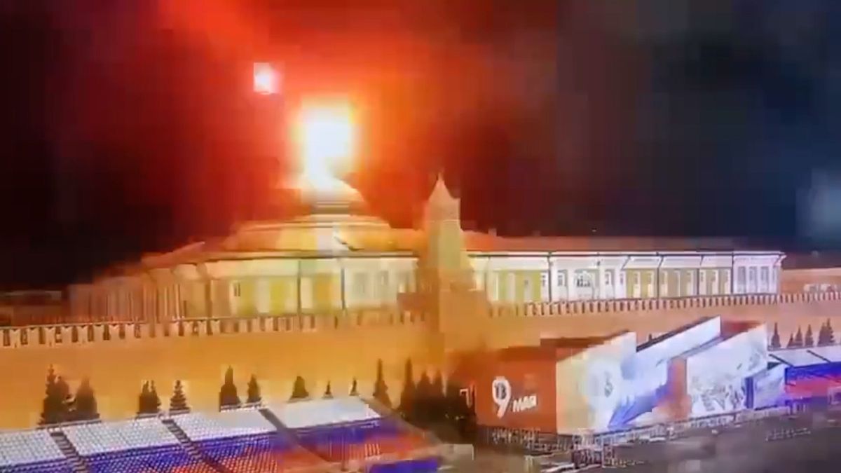 A still image taken from video shows a flying object exploding in an intense burst of light near the dome of the Kremlin Senate building during the alleged Ukrainian drone attack in Moscow.