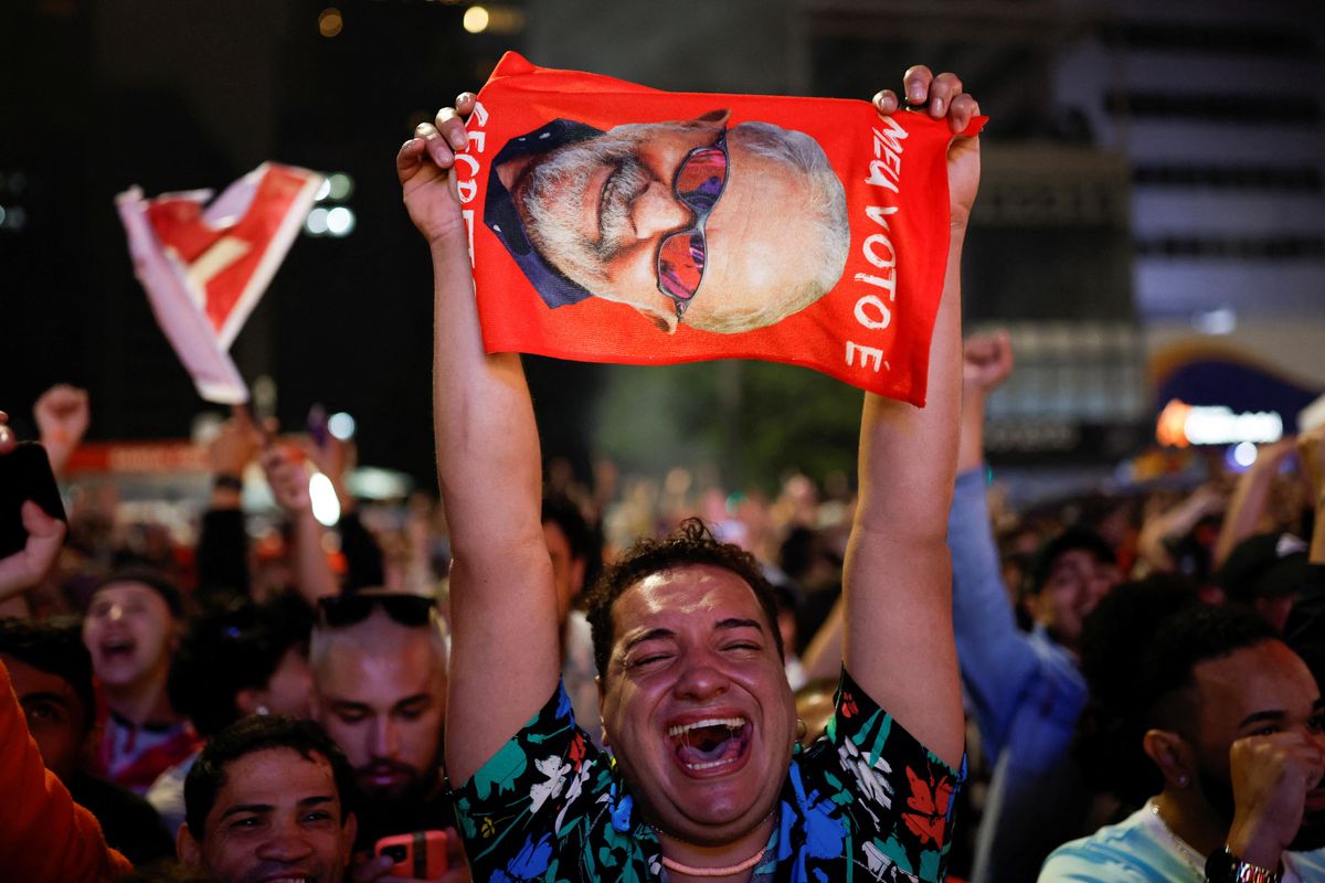 A supporter of former President Luiz Inacio Lula da Silva reacts as people gather after polling stations were closed in the presidential election in Sao Paulo, Brazil.