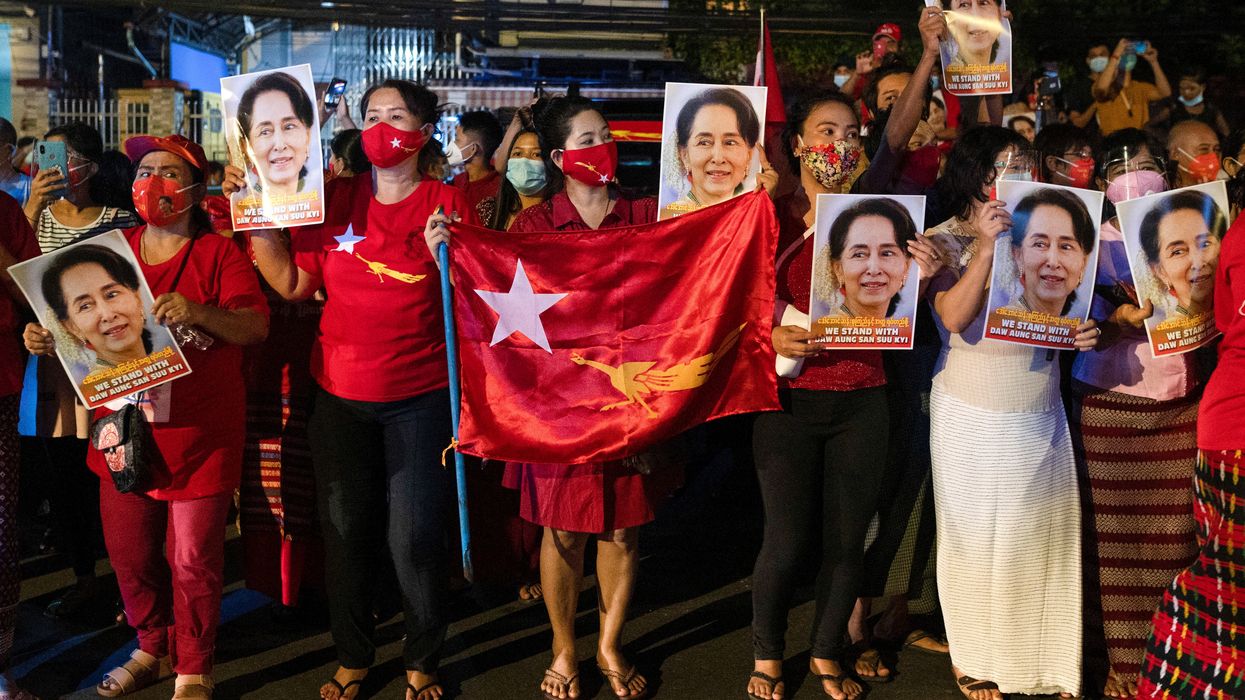 A supporter of National League for Democracy gather to celebrate at party headquarters after the general election in Yangon, Myanmar