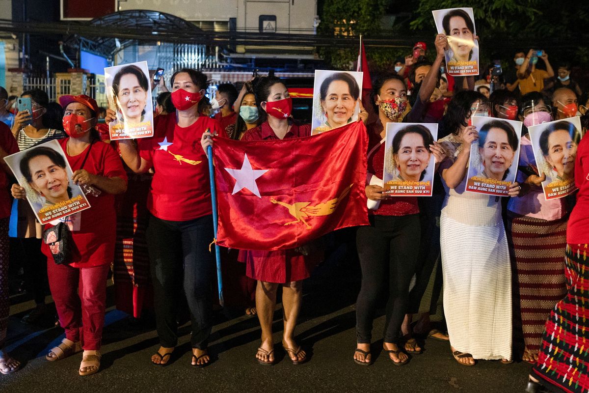 A supporter of National League for Democracy gather to celebrate at party headquarters after the general election in Yangon, Myanmar