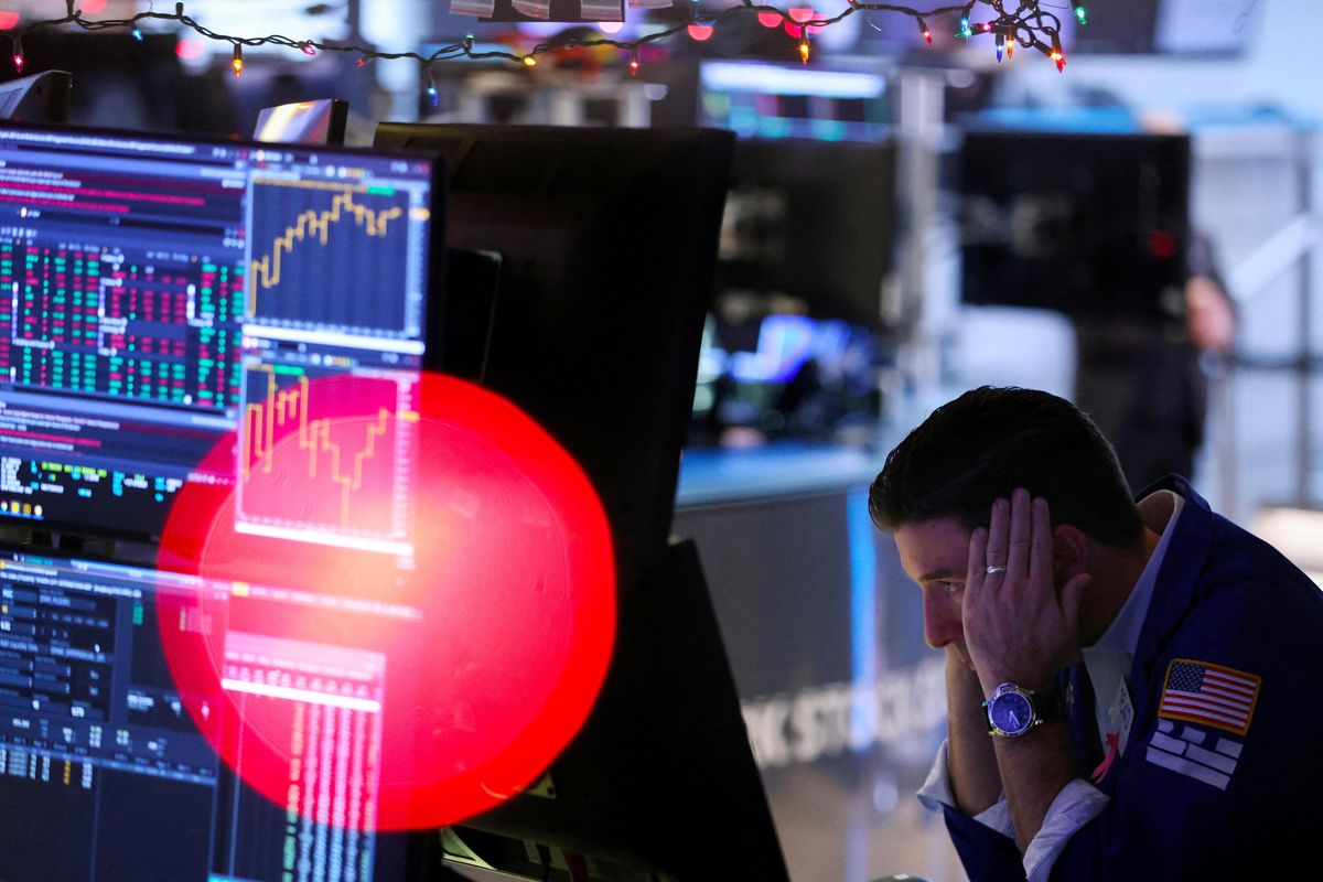 A trader works on the trading floor at the New York Stock Exchange in New York City, U.S.