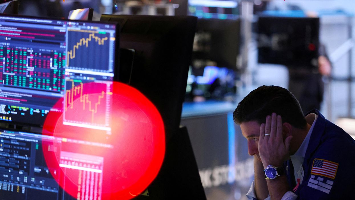 A trader works on the trading floor at the New York Stock Exchange in New York City, U.S.