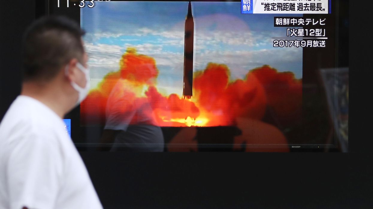 A TV monitor announces the news of North Korea's ballistic missile launch in Chiyoda Ward, Tokyo.