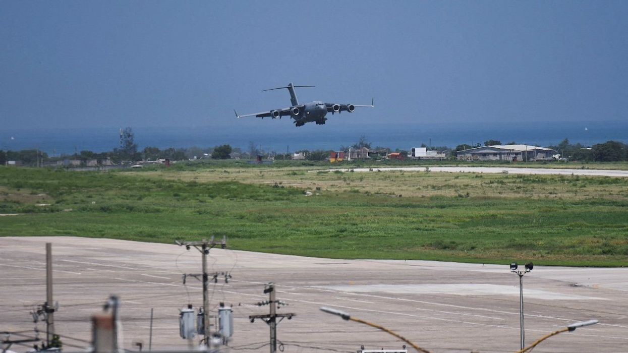 A U.S. force aircraft arrives with contractors to build a base for a Kenyan-led international security force aimed at countering gang violence, in Port-au-Prince, Haiti May 11, 2024.