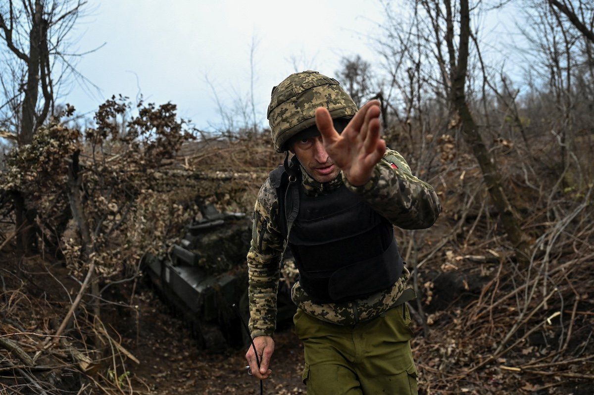 A Ukrainian serviceman gestures next to a 2S1 Gvozdika self-propelled howitzer before firing toward Russian troops, amid Russia's attack on Ukraine, at a position on a front line in Zaporizhzhia region, Ukraine November 15, 2023