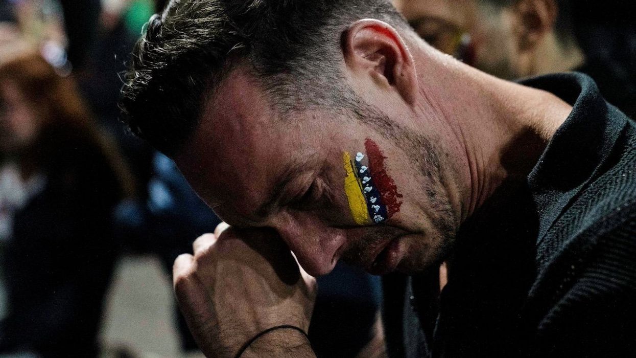 A Venezuelan opposition supporter reacts after the results of the presidential election, outside Venezuela's Embassy in Mexico City, Mexico, July 28, 2024.