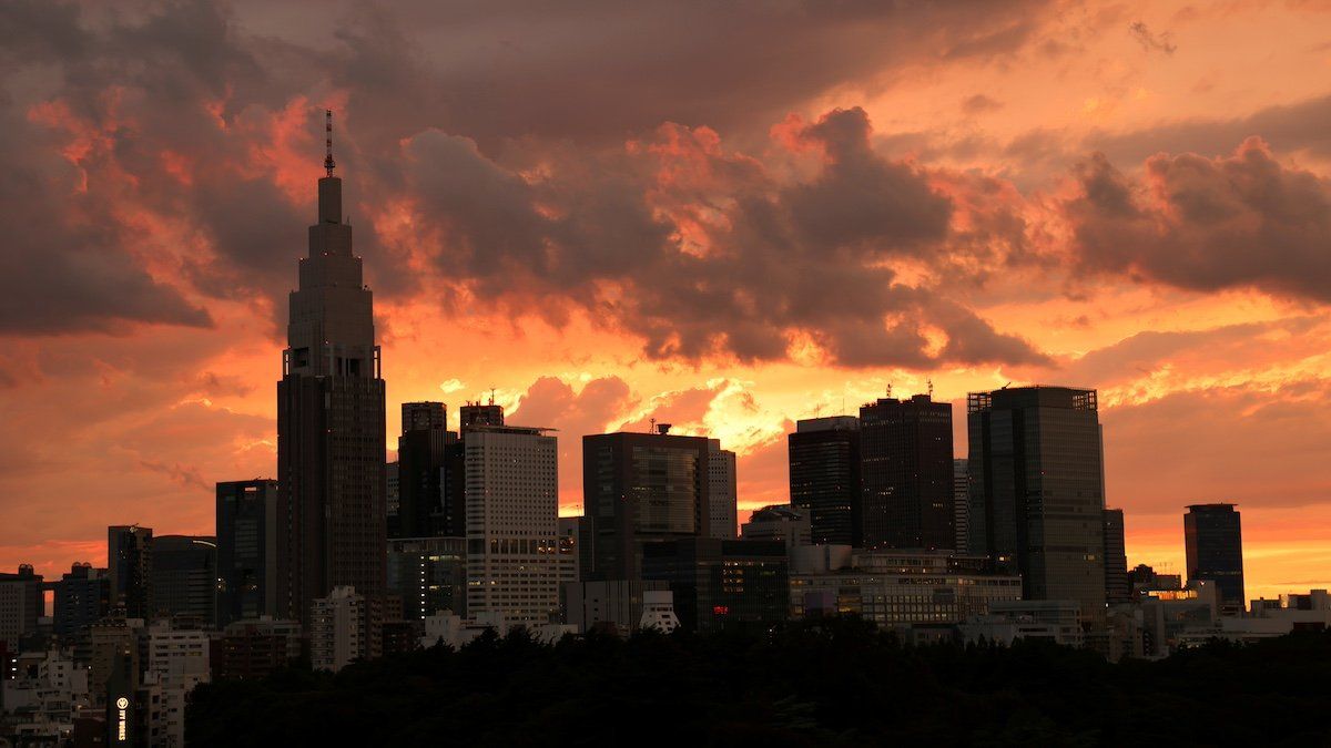 ​A view of the skyline and buildings at Shinjuku district during sunset in Tokyo, Japan June 20, 2021. 