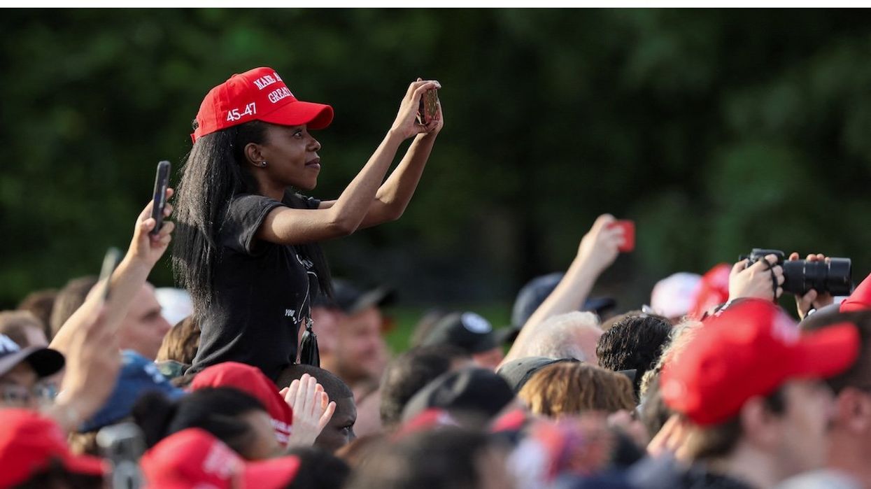 A woman attends a campaign rally by former President and Republican presidential candidate Donald Trump at Crotona Park in the Bronx borough of New York City, on May 23, 2024.