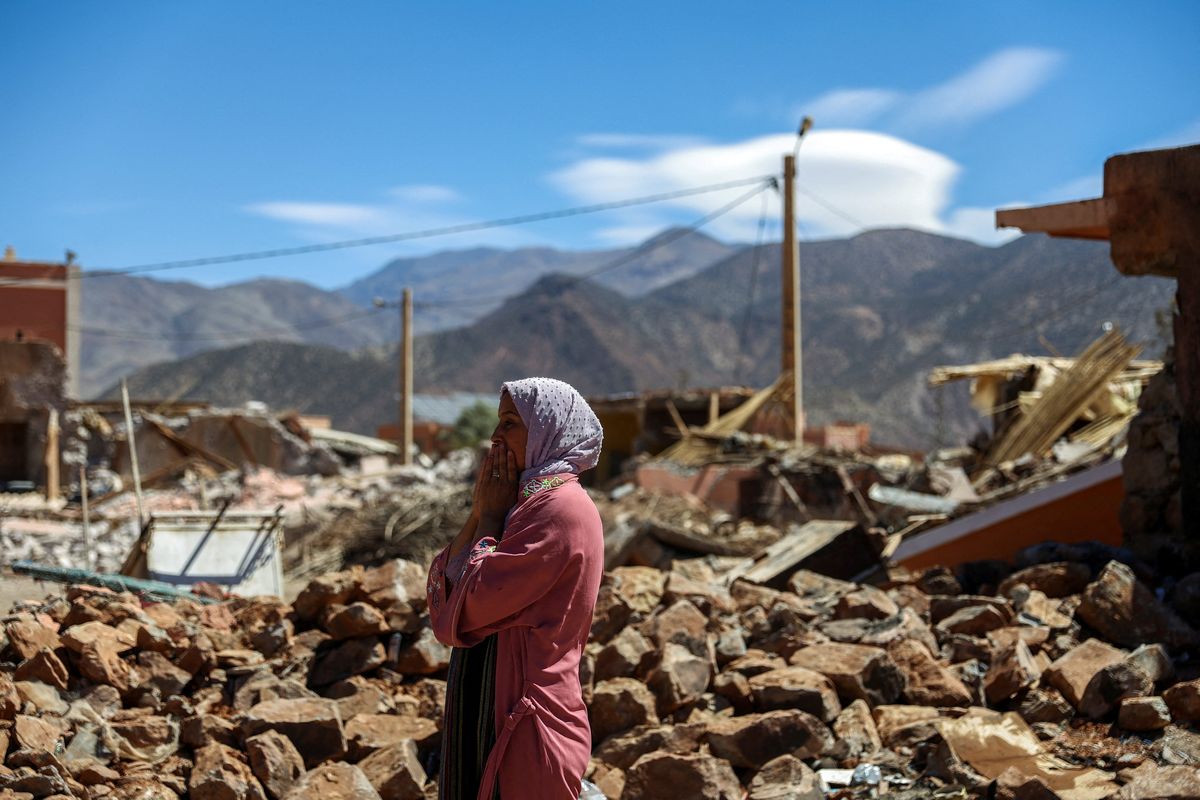 A woman reacts near the rubble of a building in the aftermath of a deadly earthquake in Talat N'yaaqoub, Morocco, September 11, 2023.