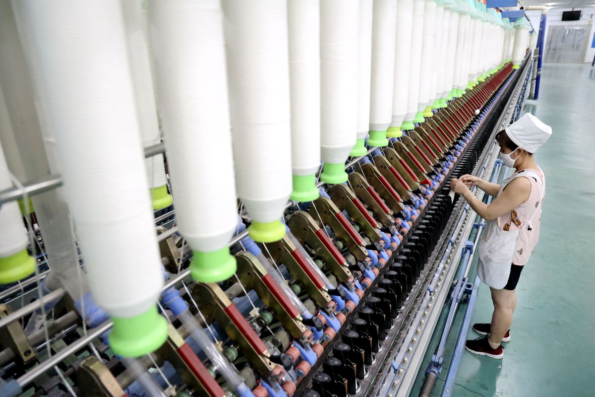  A worker works at a workshop of a textile company in Binzhou city, East China's Shandong province.