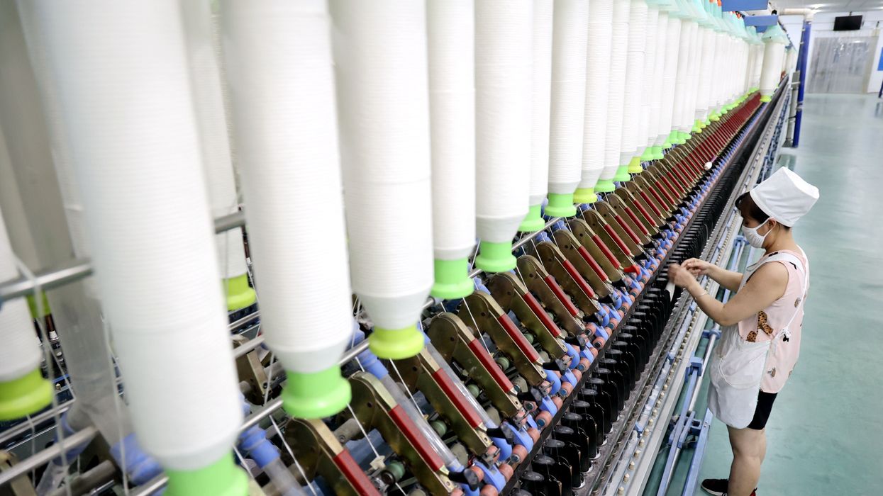 A worker works at a workshop of a textile company in Binzhou city, East China's Shandong province.