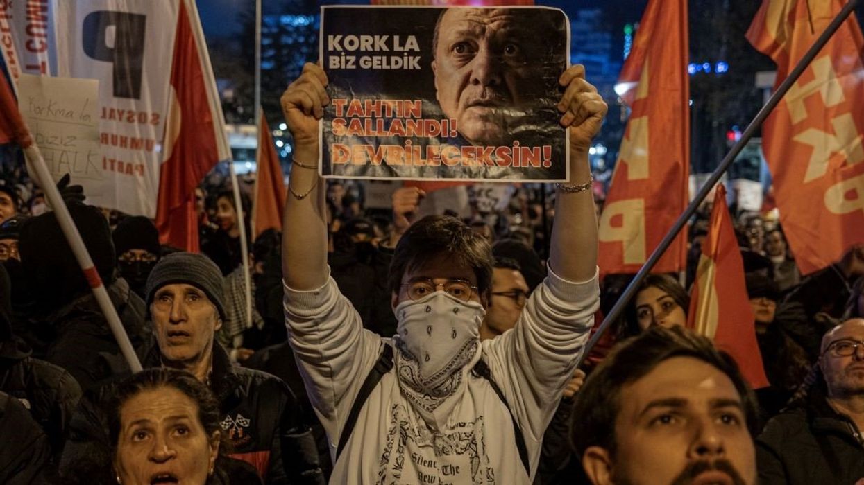 A young protester is holding a banner with a photo of Turkey's President Recep Tayyip Erdogan during the demonstration. Protests in Ankara continue into their fifth day following the arrest of Istanbul Metropolitan Municipality Mayor, Ekrem Imamoglu.