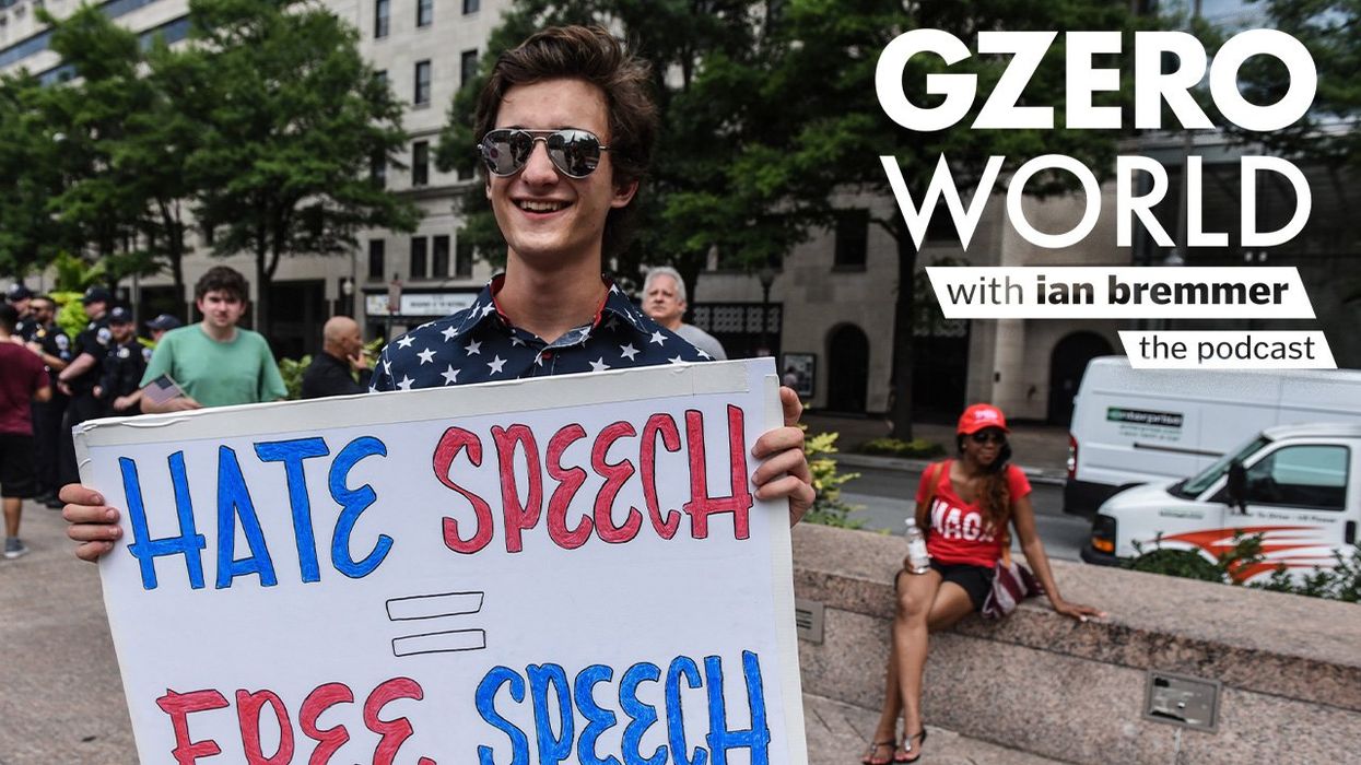 A young protester wearing a stars-and-stripes shirt holds a sign reading "Hate Speech = Free Speech" at a public demonstration. Text art reads "GZERO World with Ian Bremmer – the podcast."