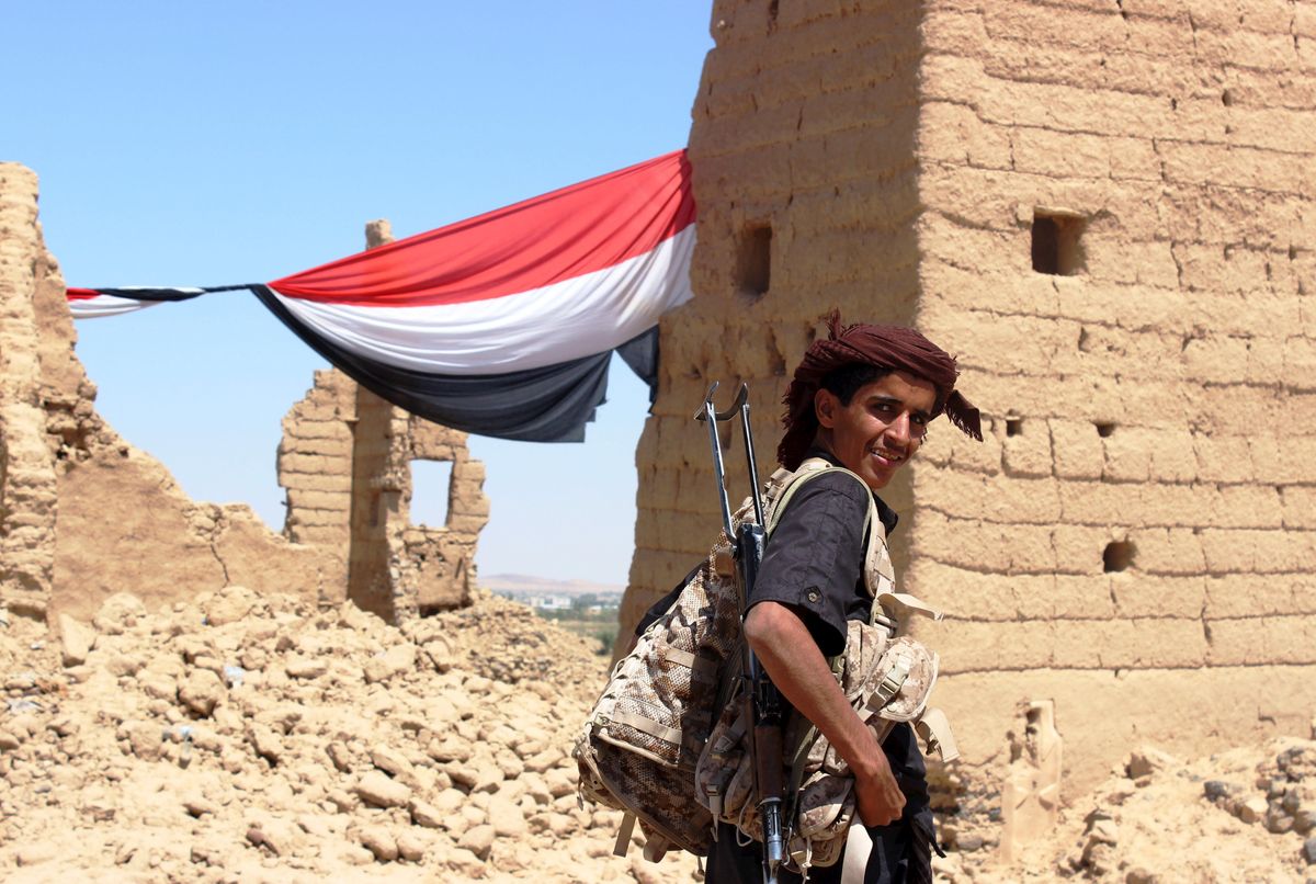 A young Yemeni fighter shouldering a weapon smiles at the camera near Marib, Yemen October 16, 2015. Marib is a city that is heavily armed even by the standards of Yemen, where the ready availability of weapons helped start civil war and is now preventing anyone coming out on top. Yemenis often say there are three guns for every person, a boast that has become an urgent concern in a country where the United Nations says the humanitarian situation is "critical". 