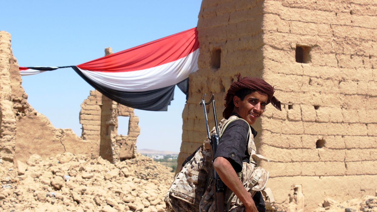 A young Yemeni fighter shouldering a weapon smiles at the camera near Marib, Yemen October 16, 2015. Marib is a city that is heavily armed even by the standards of Yemen, where the ready availability of weapons helped start civil war and is now preventing anyone coming out on top. Yemenis often say there are three guns for every person, a boast that has become an urgent concern in a country where the United Nations says the humanitarian situation is "critical".