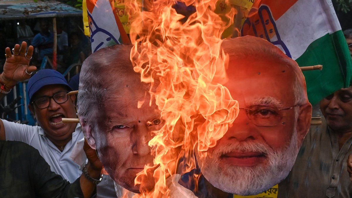 ​Activists burn an effigy of US President Donald Trump and Prime Minister of India Narendra Modi in Kolkata, India, on August 1, 2025.