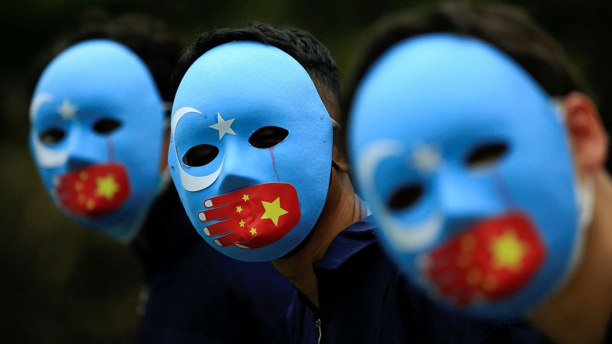Activists take part in a protest against China's treatment of the ethnic Uyghur people in Jakarta, Indonesia.