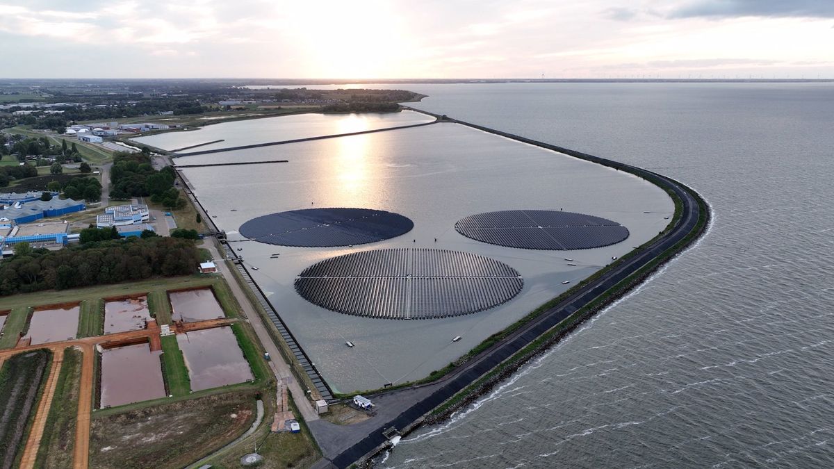 Aerial view of a coastline with a sustainable facility in the water