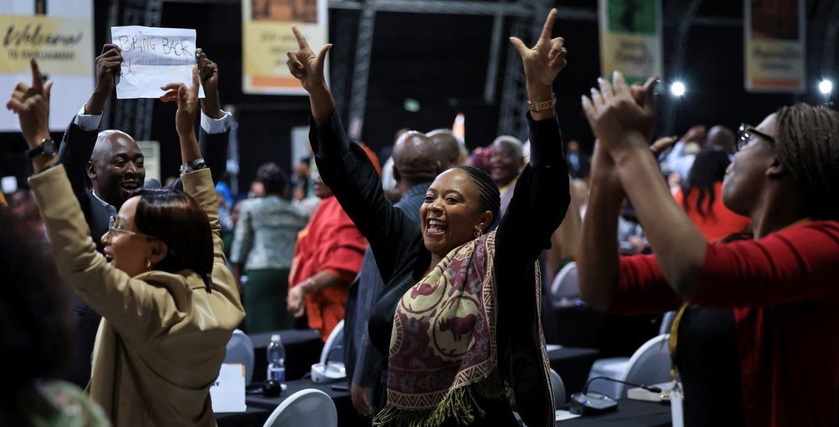 ​African National Congress (ANC) members of parliament react after South African lawmakers passed the budget's fiscal framework in Cape Town, South Africa, April 2, 2025. 