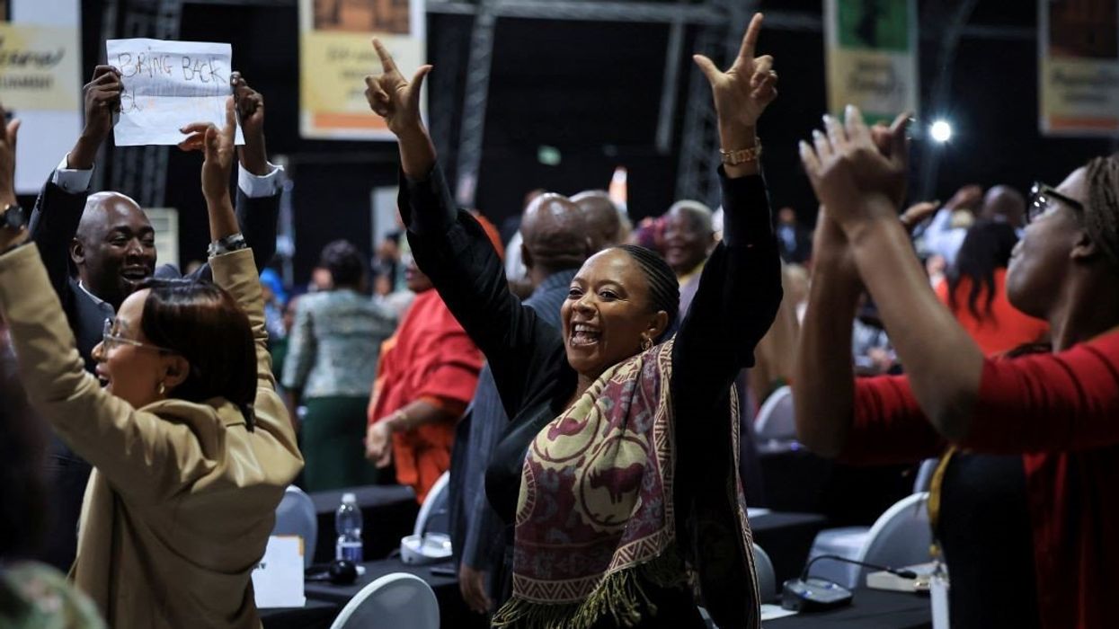 African National Congress (ANC) members of parliament react after South African lawmakers passed the budget's fiscal framework in Cape Town, South Africa, April 2, 2025.