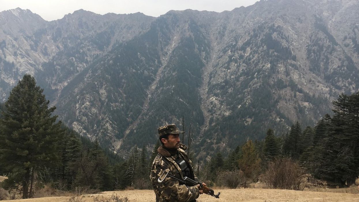 An Afghan security force personnel keeps watch near his check post in Parun, capital of Nuristan province, Afghanistan November 20, 2016.
