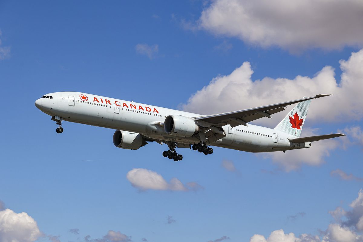An Air Canada Boeing 777-300ER aircraft approaching the runway at Heathrow Airport in London.