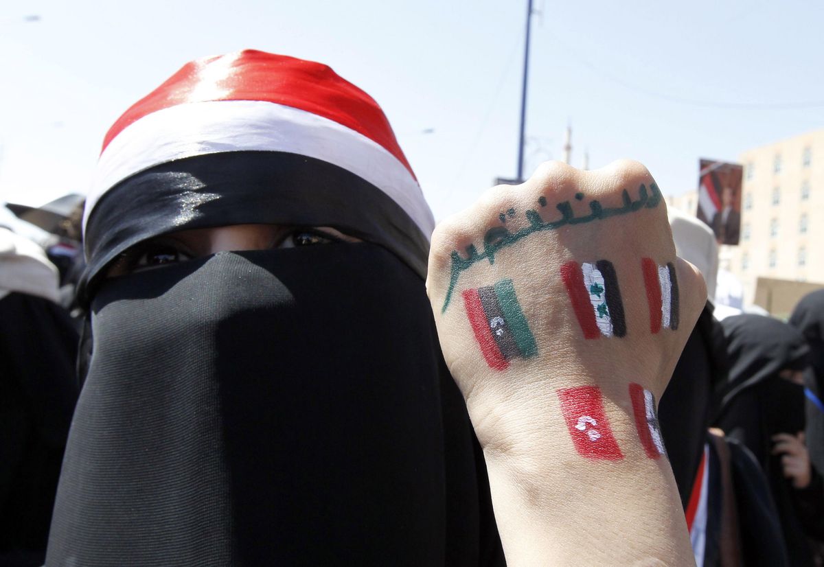 An anti-government protester displays paintings on her hand in Sanaa, Yemen, during the Arab Spring marches in 2011. Reuters